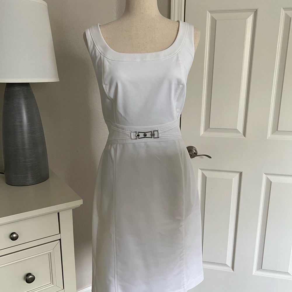 NWOT WHBM white sleeveless dress with metal embellishments size 14. Fully lined.